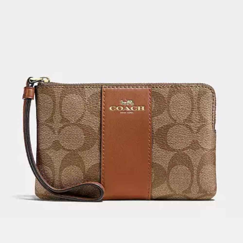 Coach CORNER ZIP WRISTLET IN SIGNATURE CANVAS
new in packaging